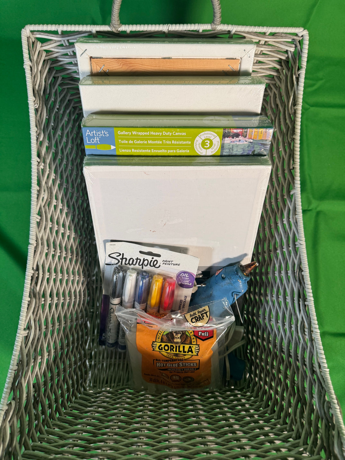 Art Supply Lot Canvases Panels and Tools in Wicker Basket — detail view 1