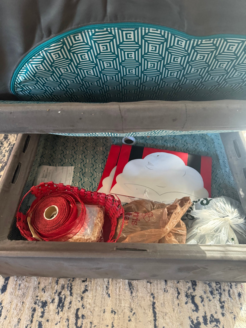 Storage compartment open under a Sactional seat
