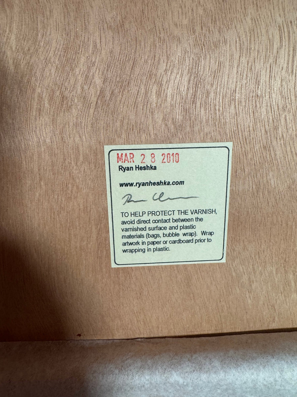 Back of the panel with the signed, dated label