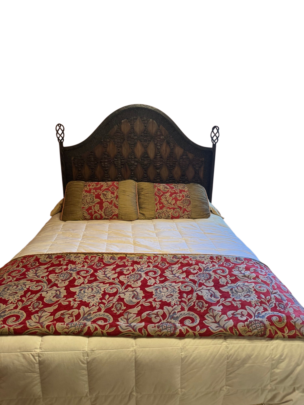 Queen bed with dark carved wooden headboard, cream quilted mattress, red and gold damask bedding, gold pillows in pink bedroom