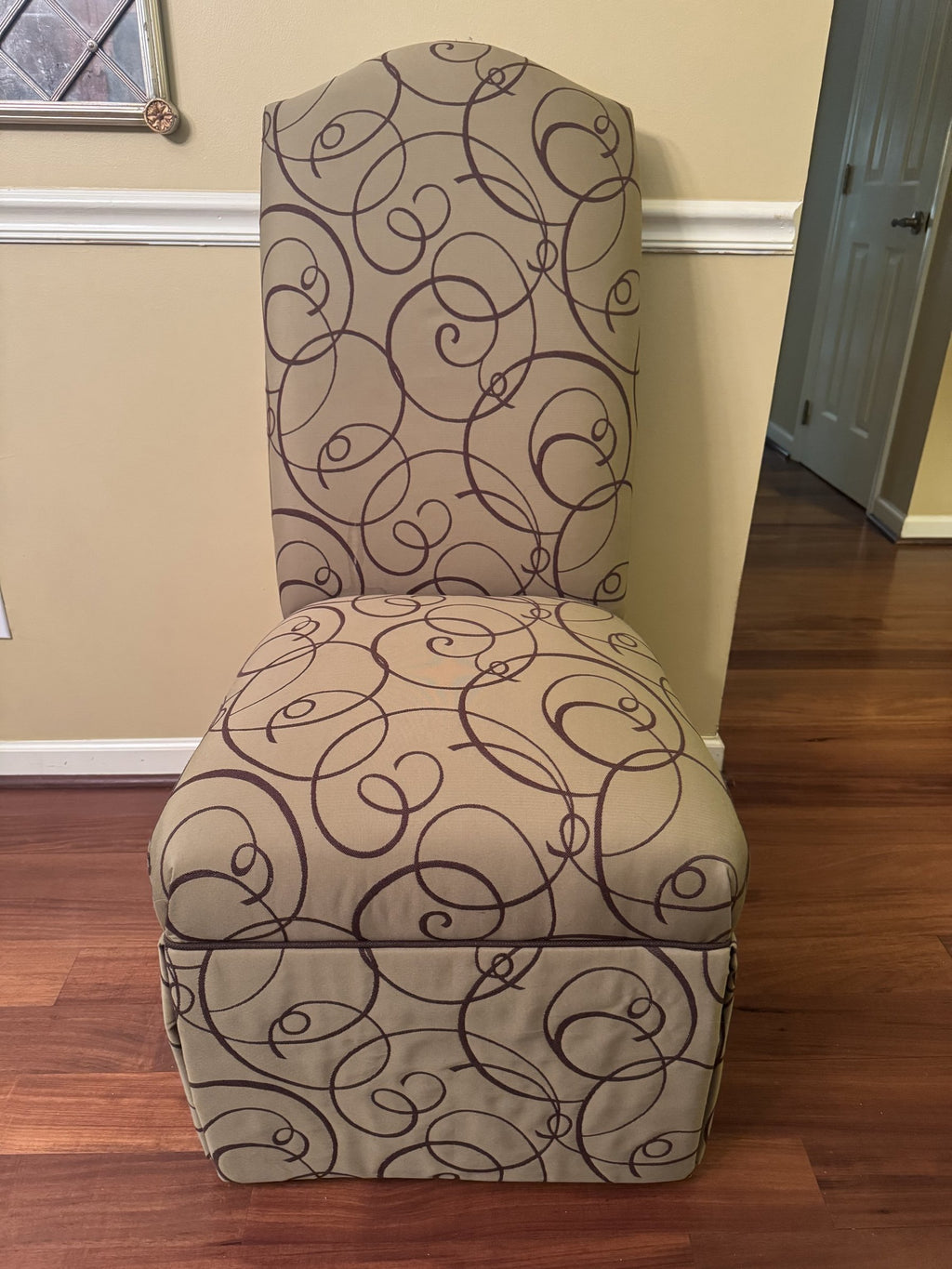 One skirted parsons dining chair seen from the front