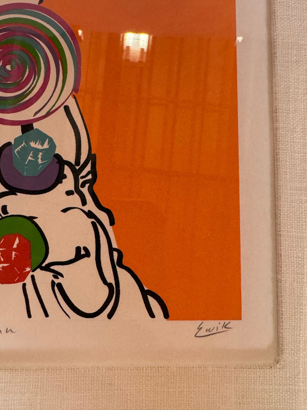 Close view of the pencil signature at the lower right