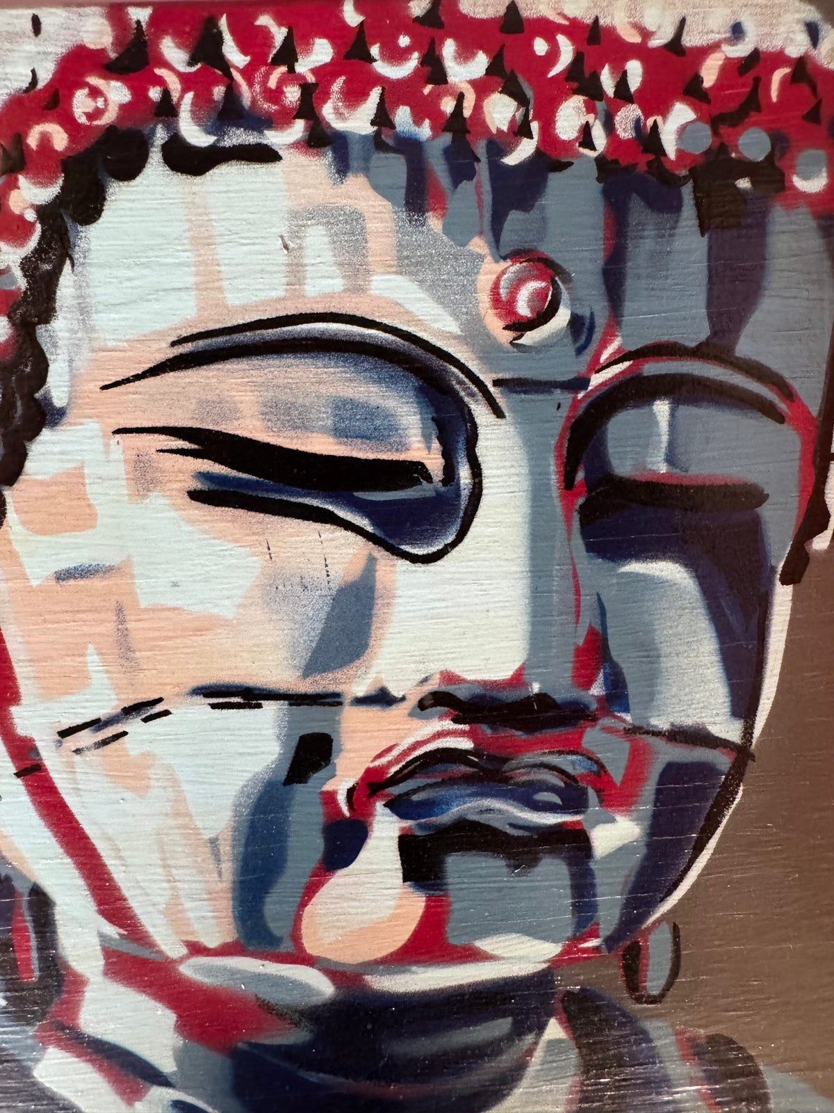 Close detail of the face and beaded curls