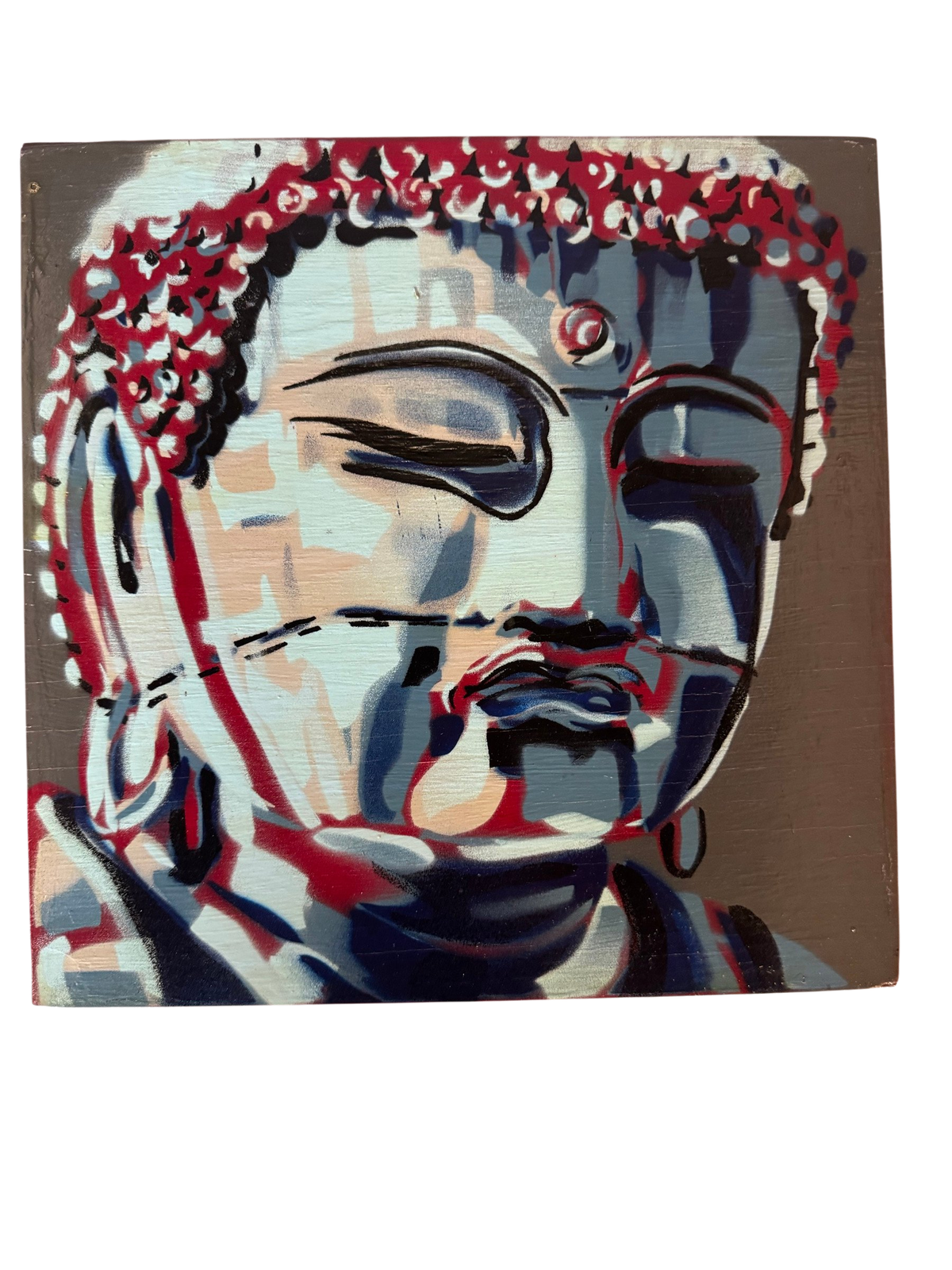 Stencil-style Buddha head painting on a small panel, straight-on