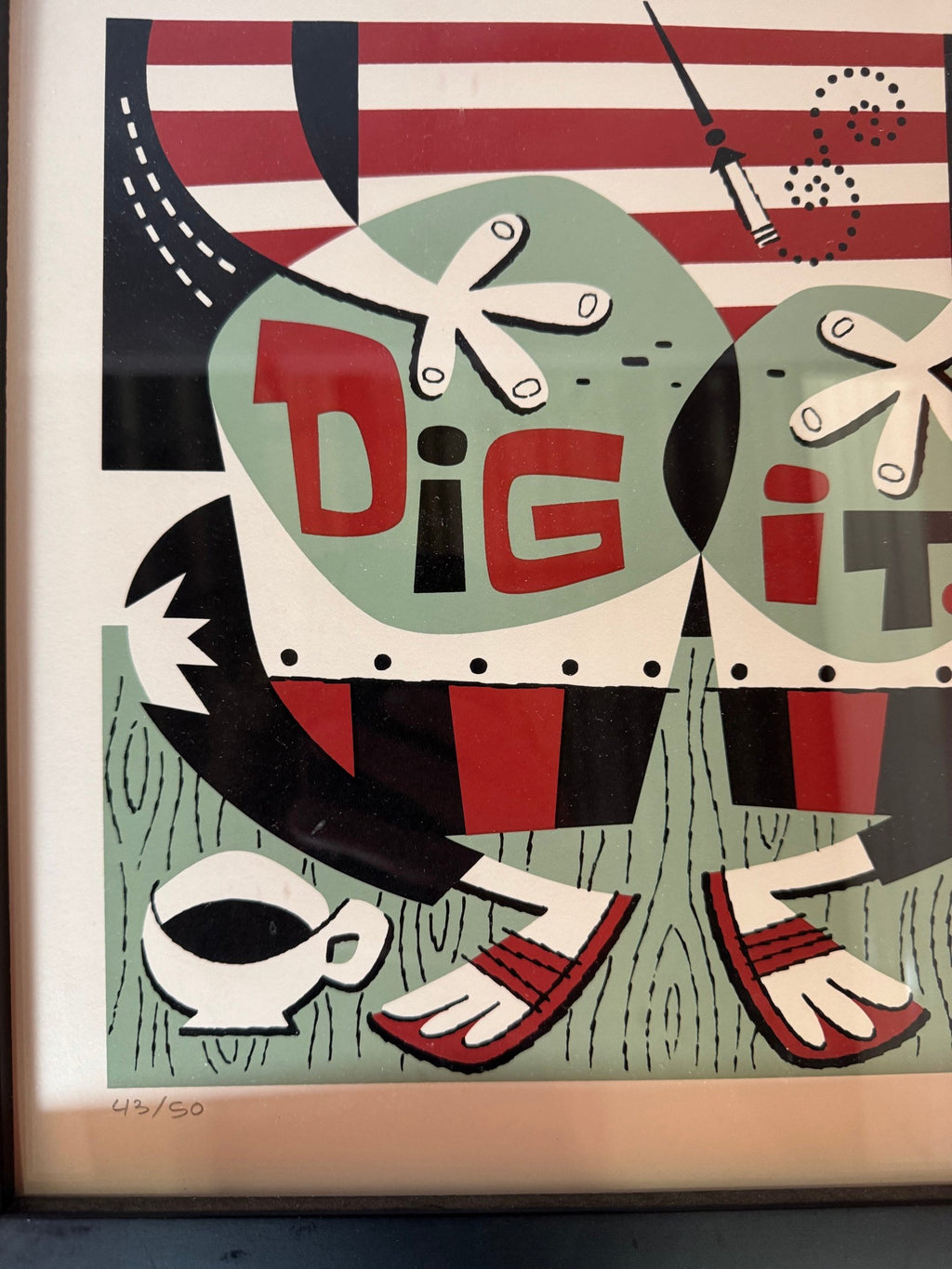Close view of the DIG IT lettering and hand