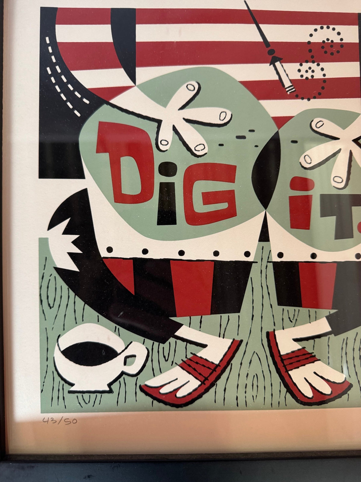 Close view of the DIG IT lettering and hand