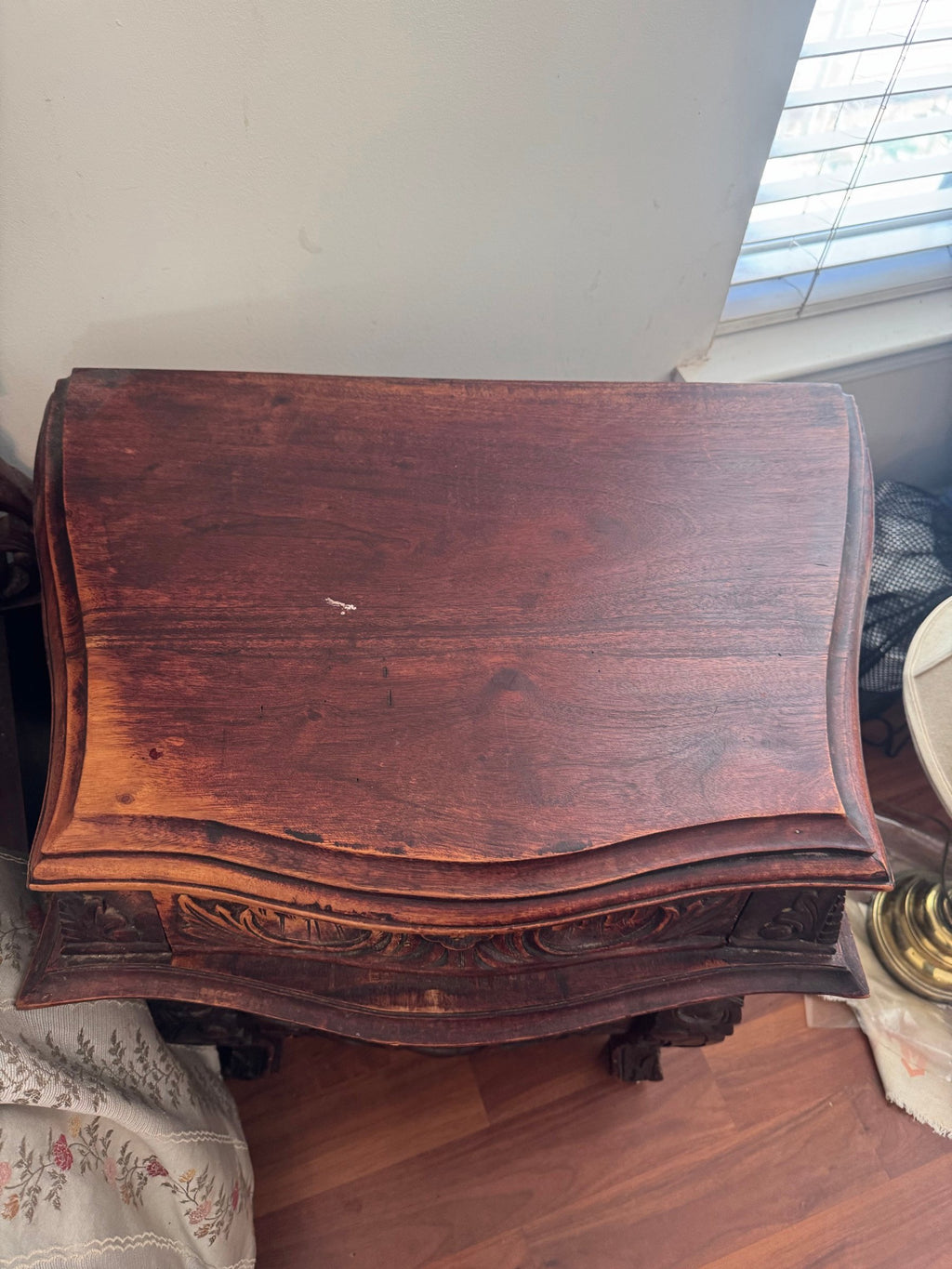 Top of the nightstand with a curved shaped top