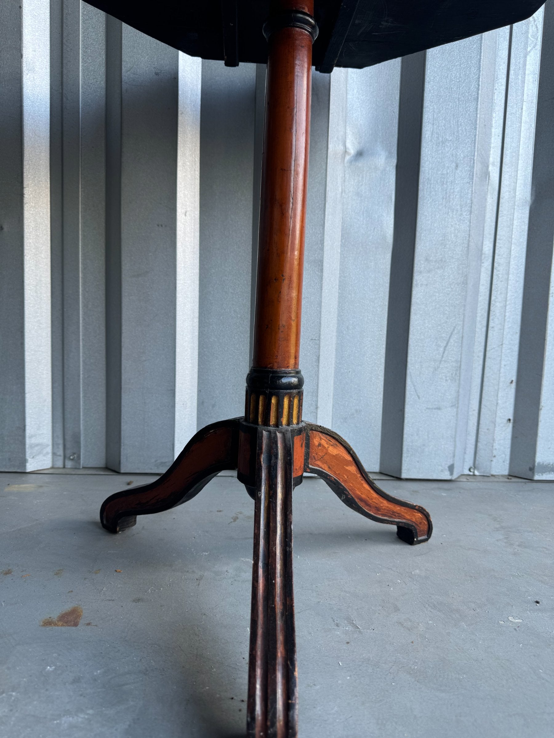 Tripod pedestal base with curved legs, showing wood construction and metal banding detail