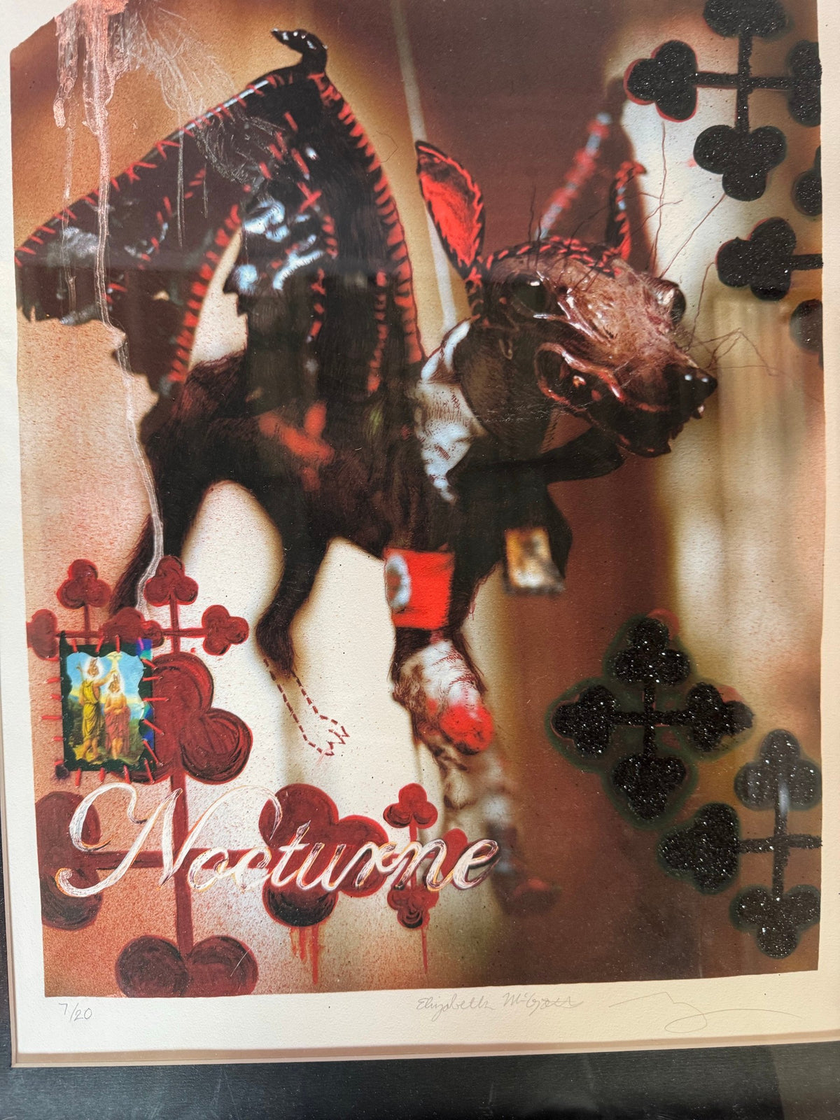 Close view of the costumed figure and club motifs