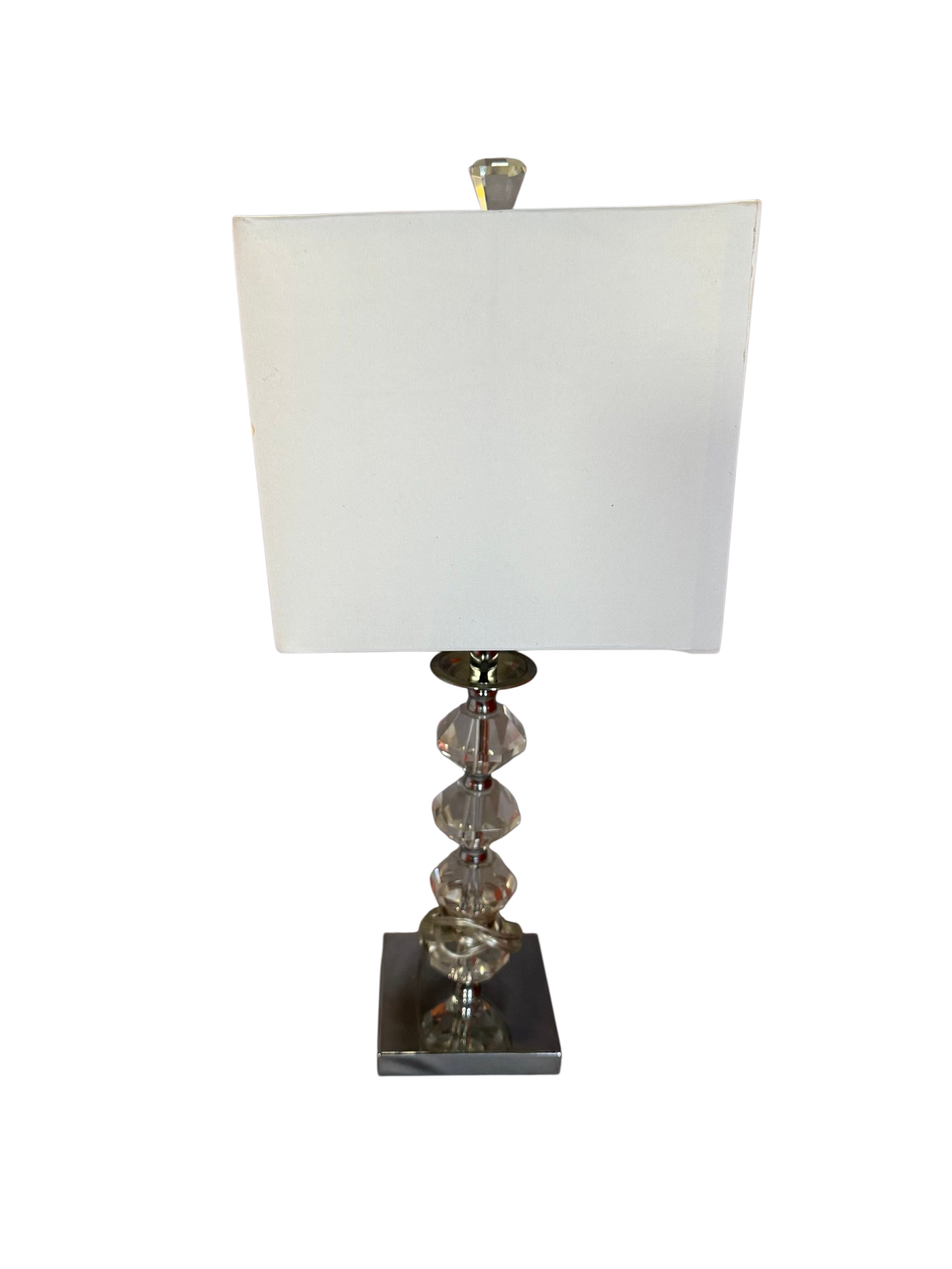 Table lamp with faceted crystal-look stem, chrome base and white rectangular shade