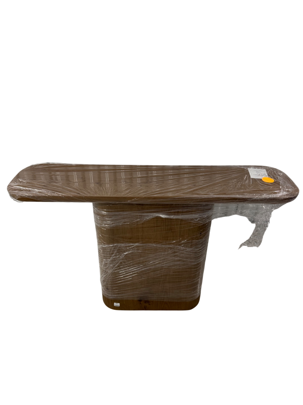RH Oslo Pedestal Console Table wrapped in plastic, walnut finish, rectangular top with pedestal base, front three-quarter view