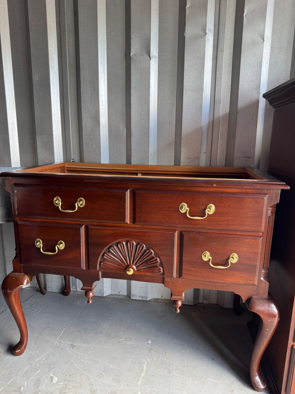 Lowboy base section with four drawers, shell carving details, cabriole legs with pad feet, interior drawer visible