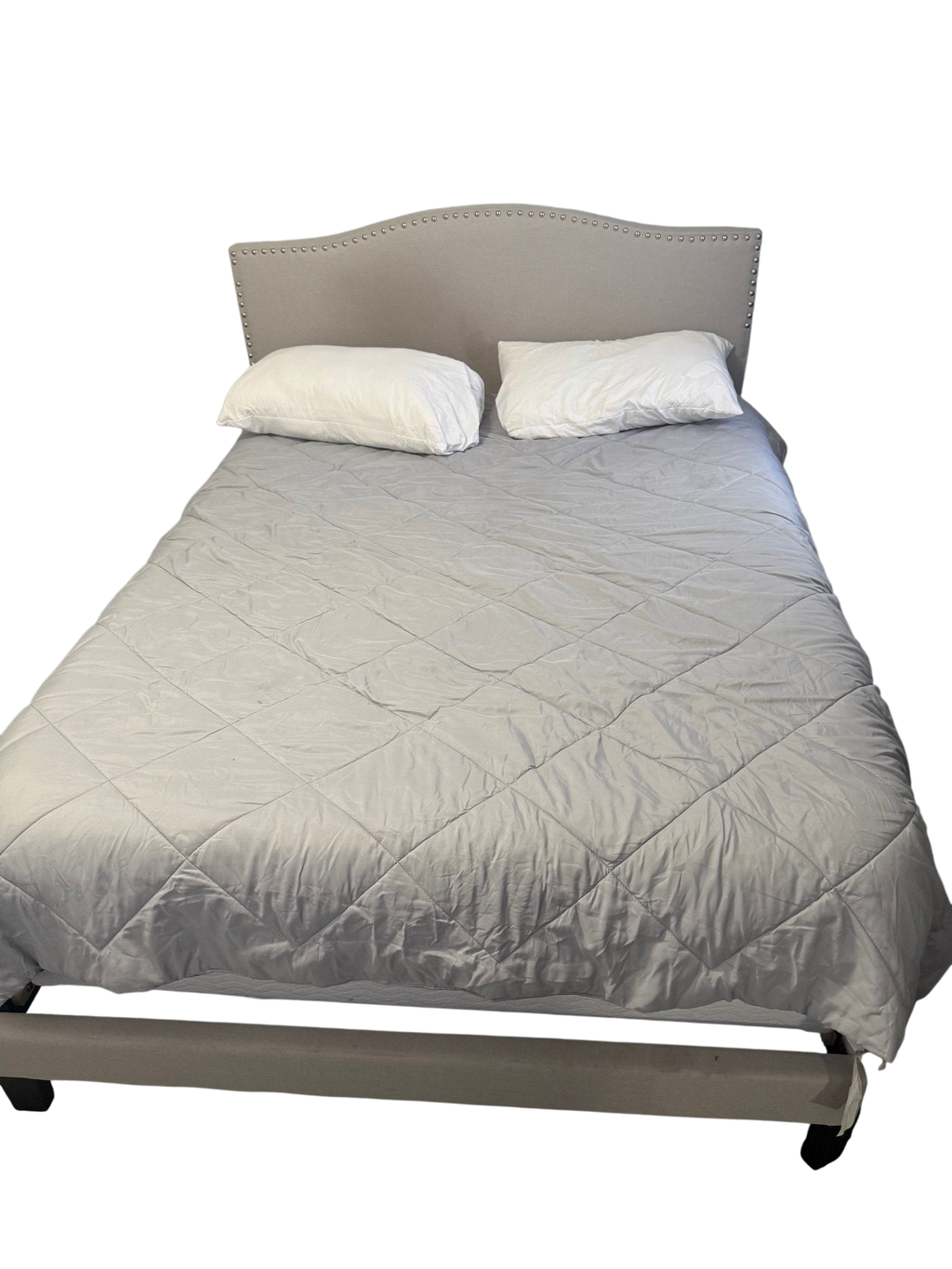 Cream upholstered bed frame with nailhead headboard