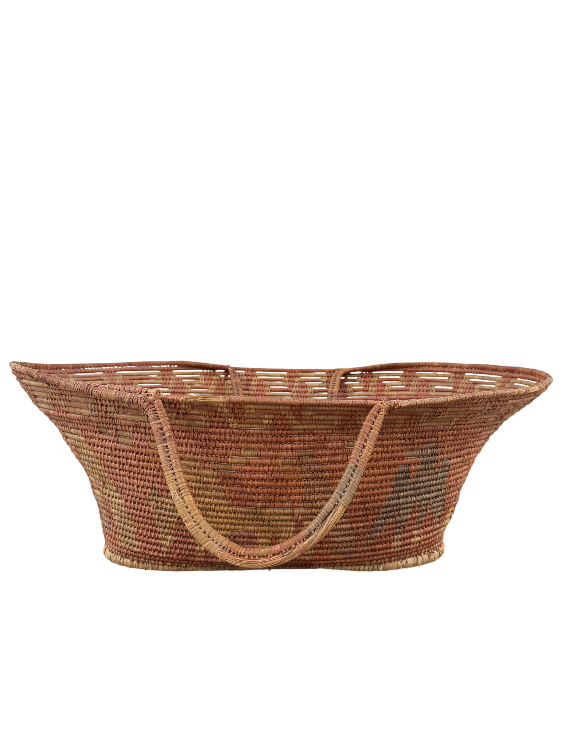 Woven basket tote with handles, overhead view showing oval shape, natural fiber in rust red and tan tones