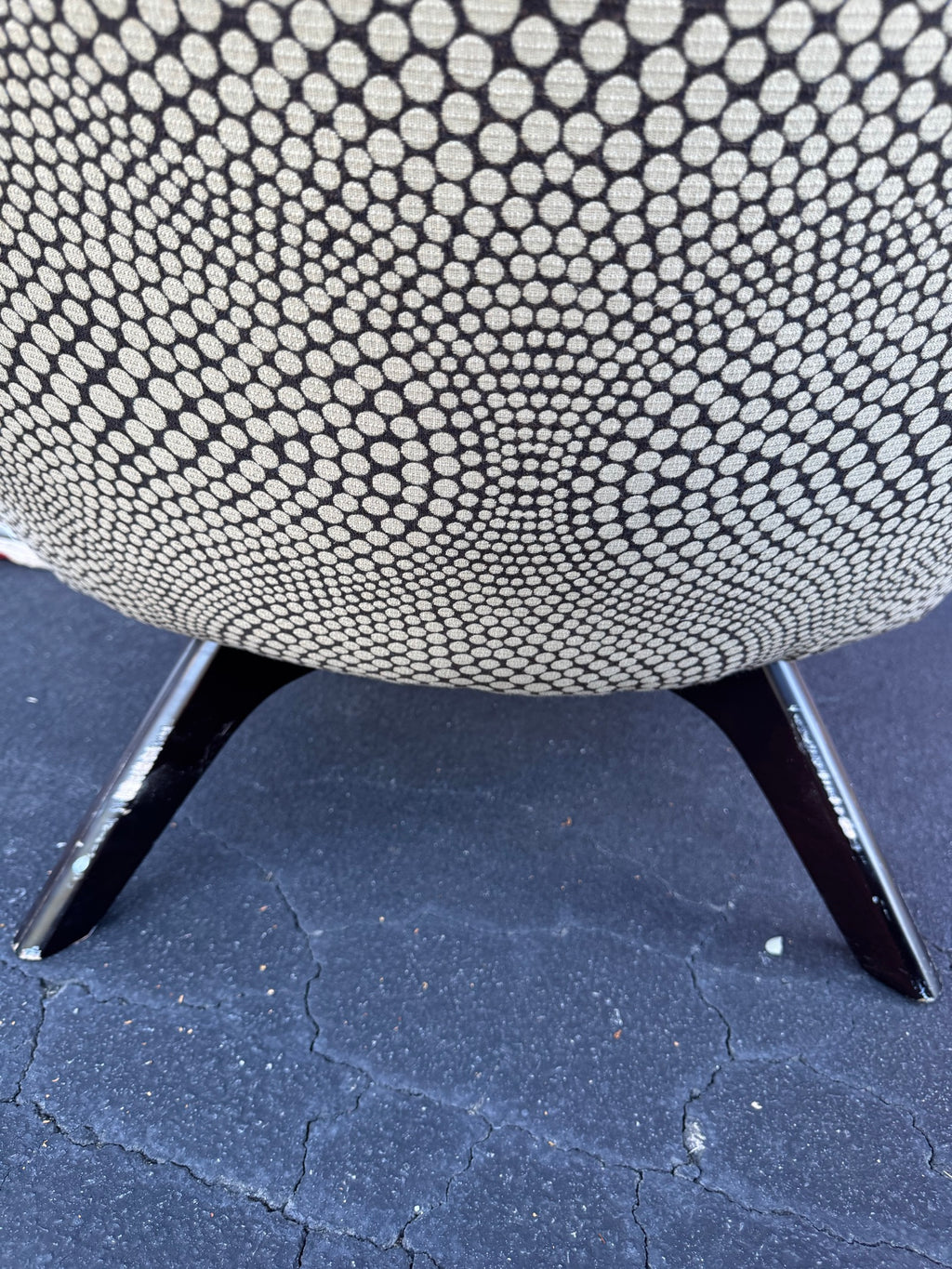 Back cushion close-up showing horizontal seam and cream and black dot textile