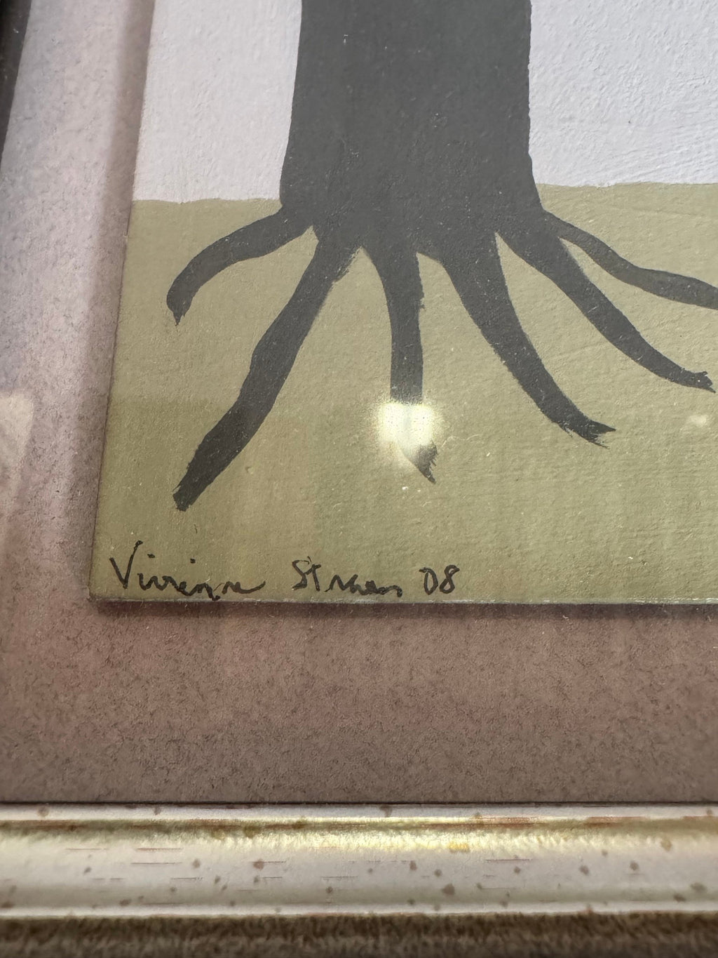 Close view of the pen signature and date 08 at the lower left