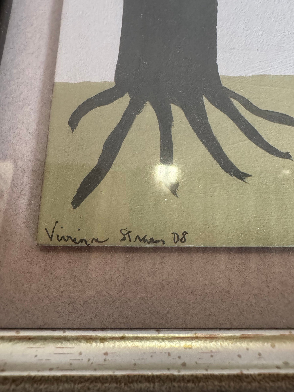 Close view of the pen signature and date 08 at the lower left