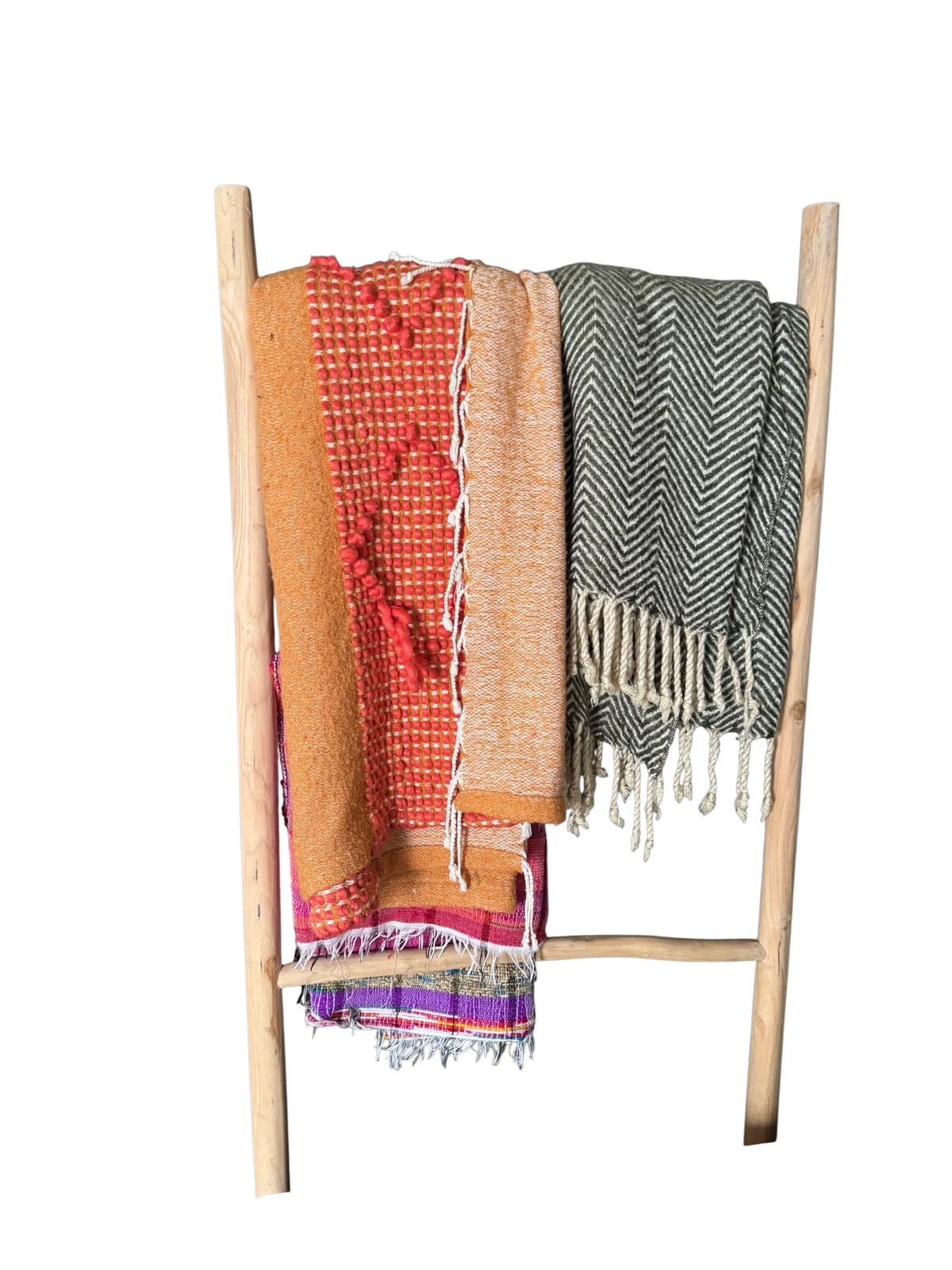 Wood blanket ladder holding two woven throws