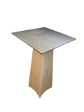 Figuration side table with grey metal top on a tapered white marble base
