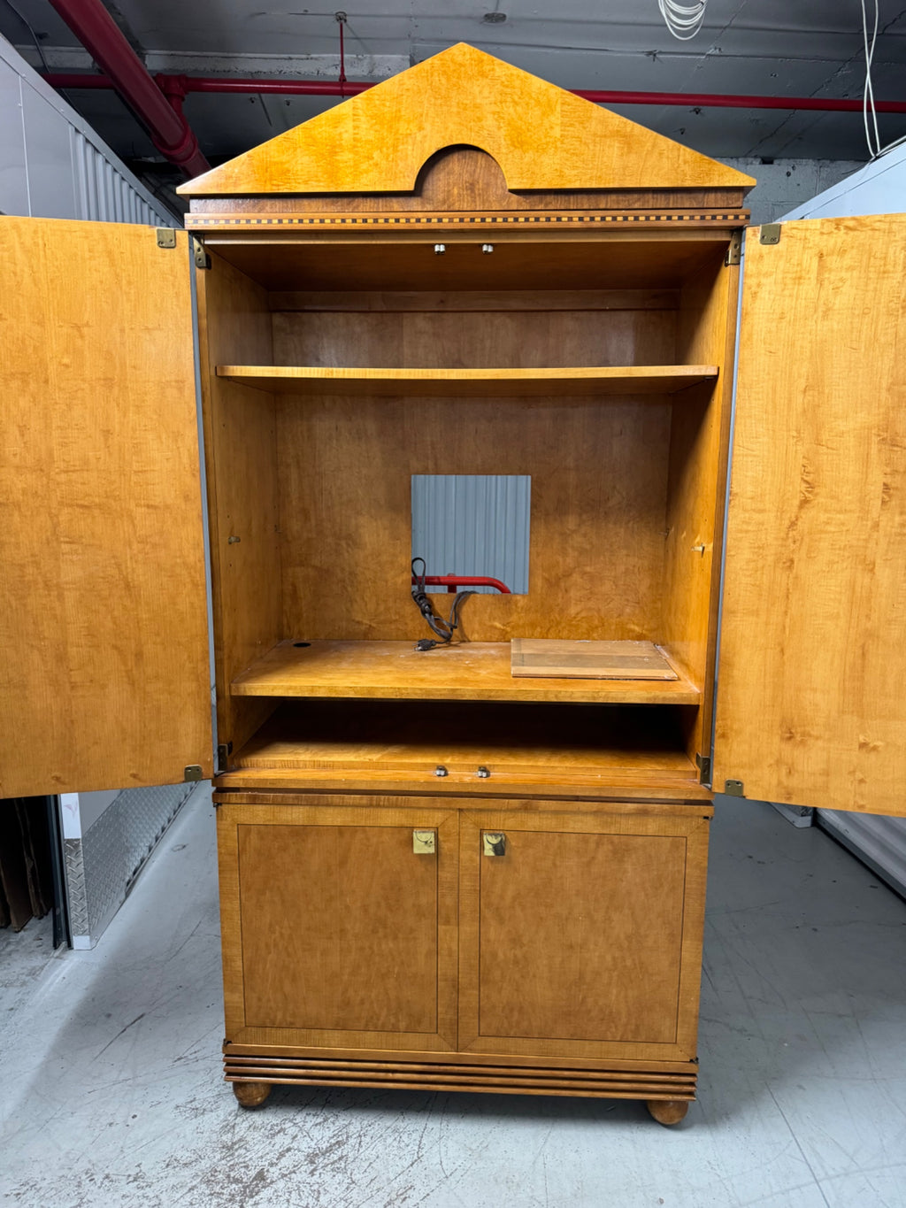 Interior upper shelving with single shelf and lighting fixture wiring visible