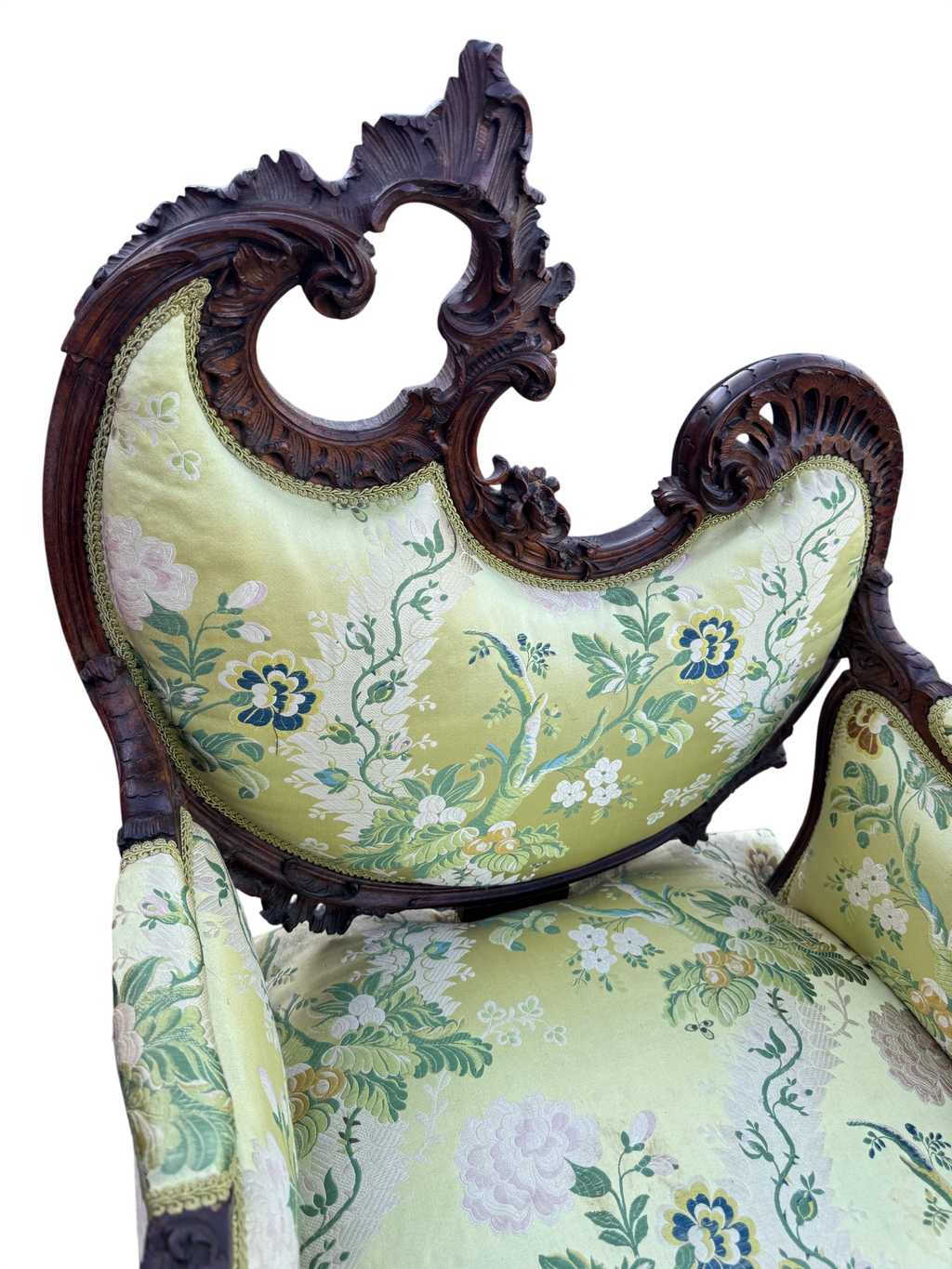 Close view of the asymmetrical pierced crest rail, deeply carved with scrolls, acanthus and a floral spray