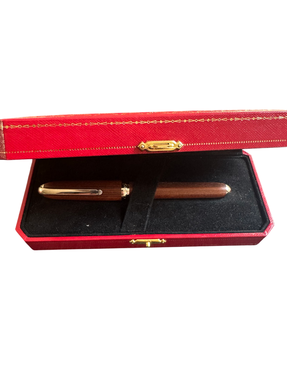 Red leather presentation box with gold-tooled trim, open to reveal black velvet interior holding two wooden pens