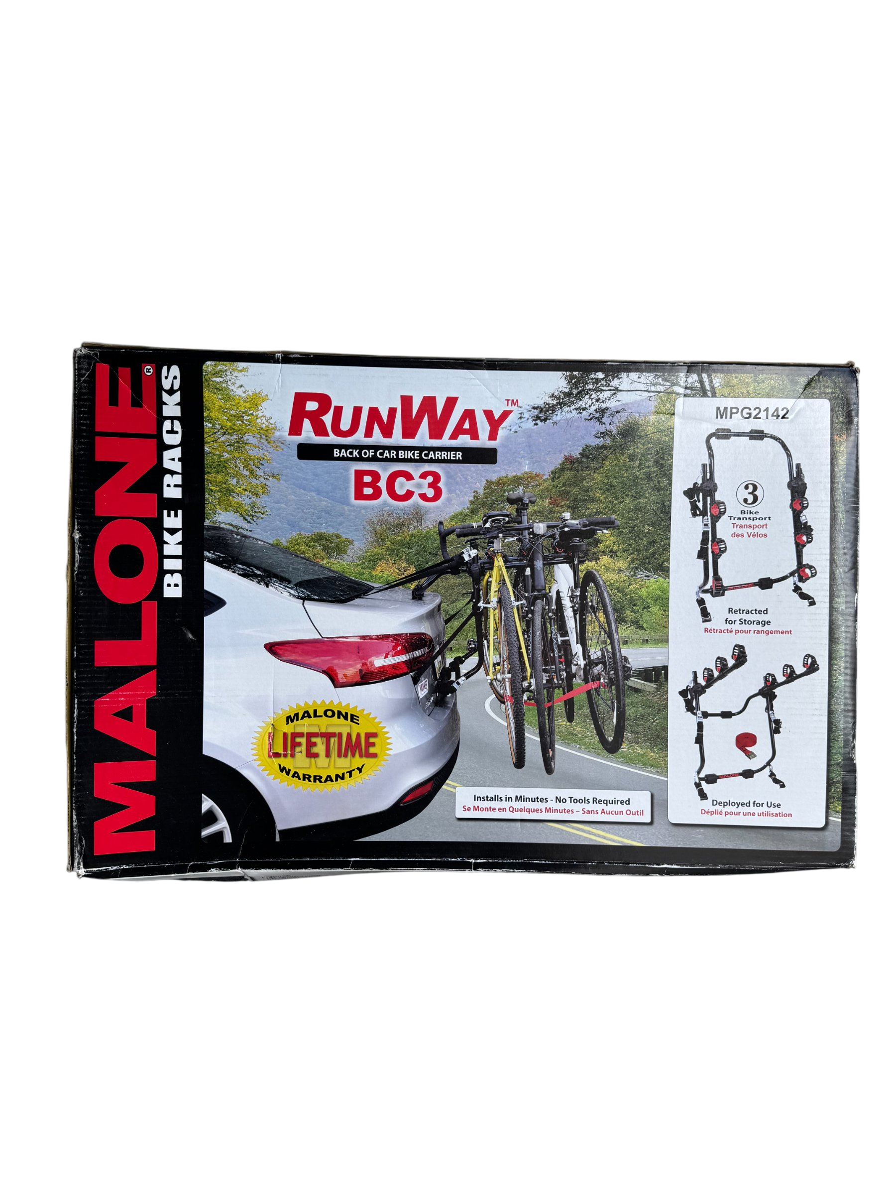 Malone RunWay BC3 bike carrier box front, showing product name, black and red branding, scenic mountain road background