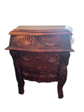 Carved bombe nightstand seen from the front
