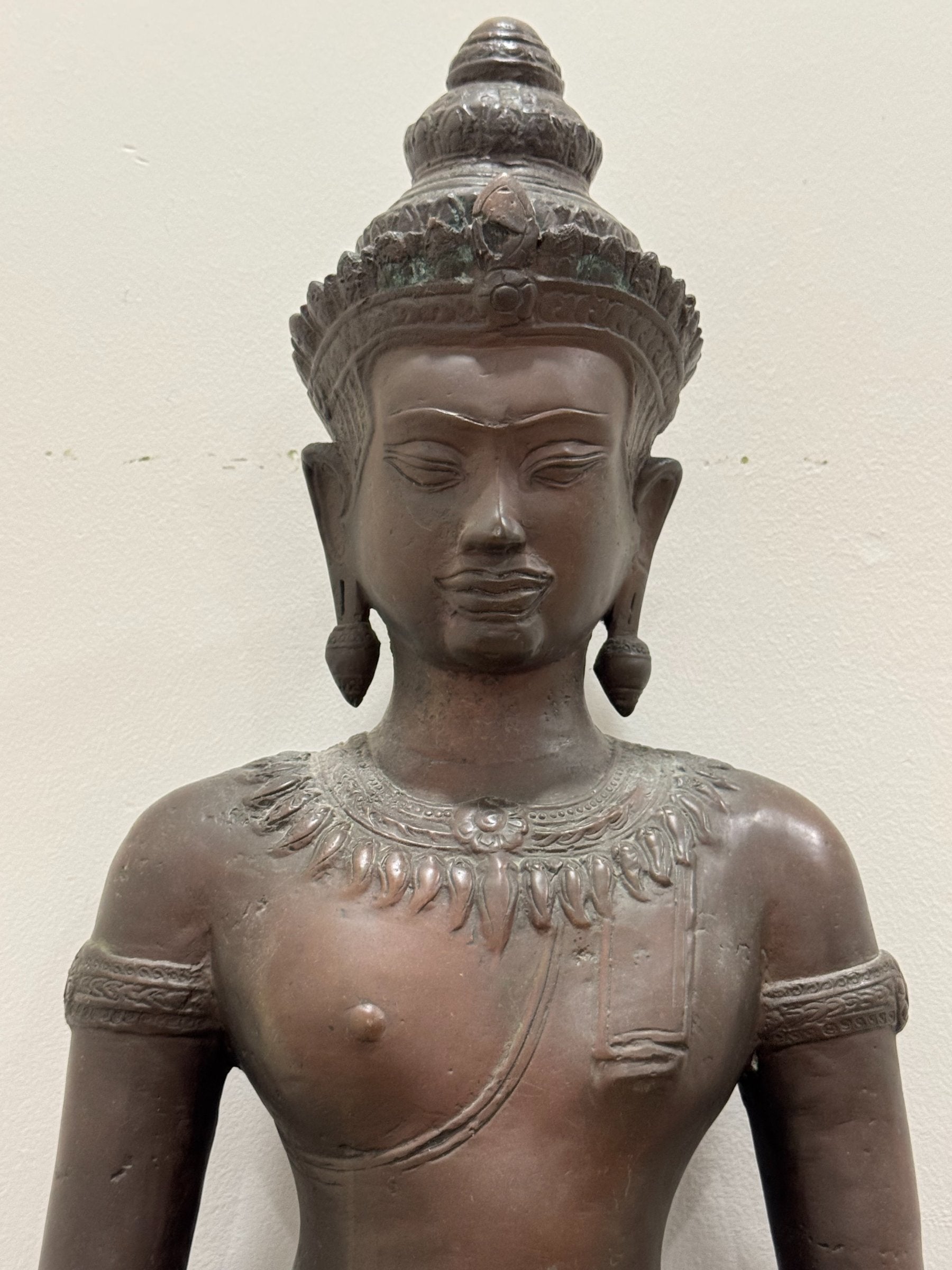 Full seated Buddha figure, front view, complete with crossed legs, hands in meditation mudra, wooden base