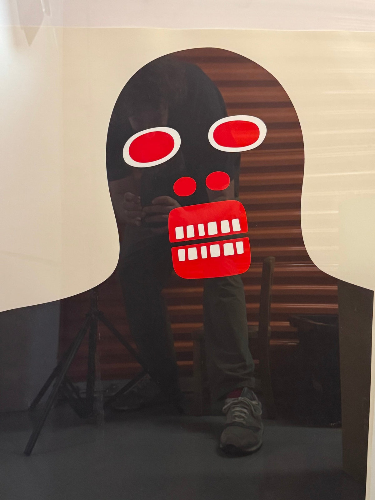 Close detail of the black figure and red teeth