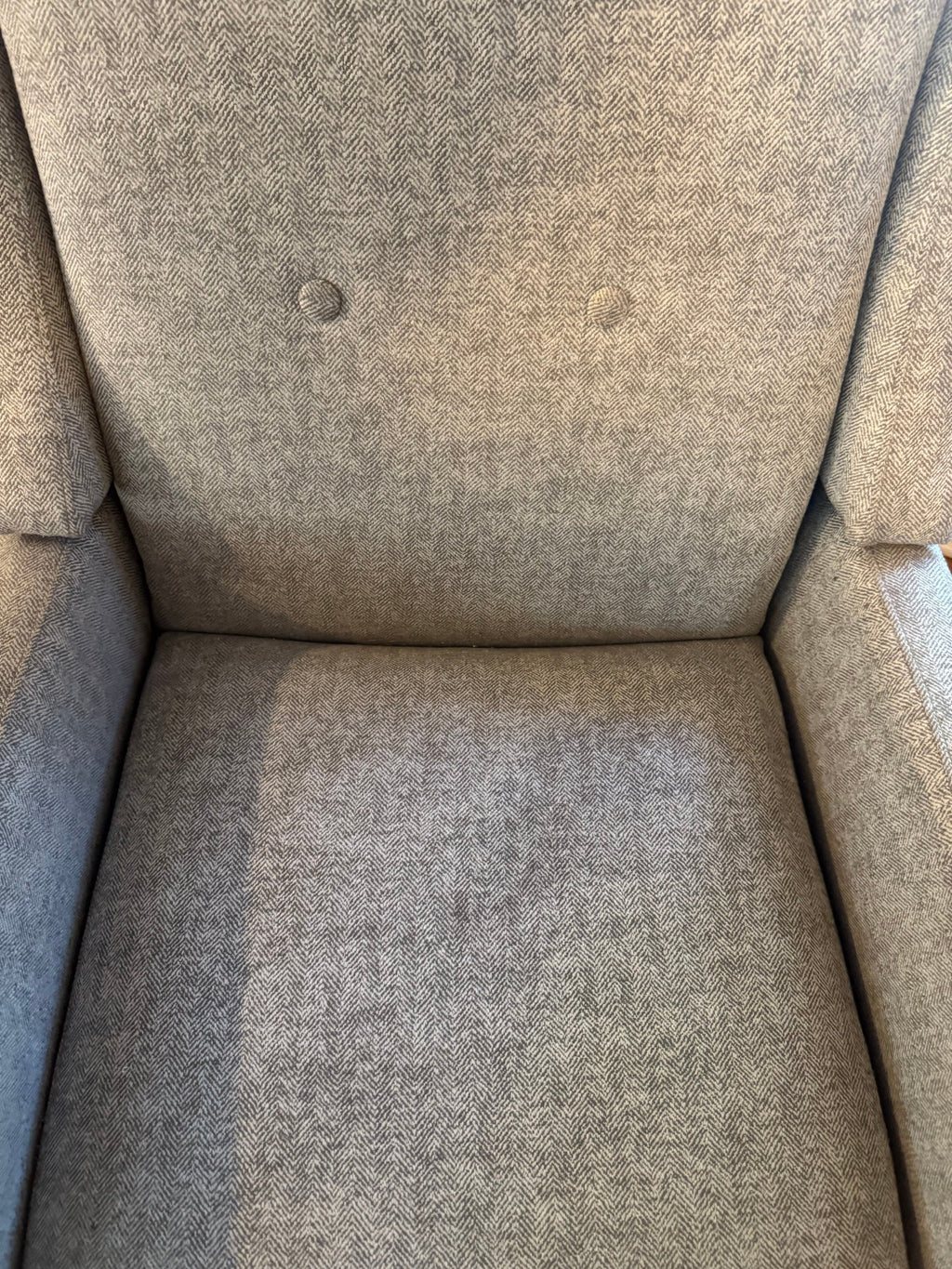 Close view of the tufted back and seat