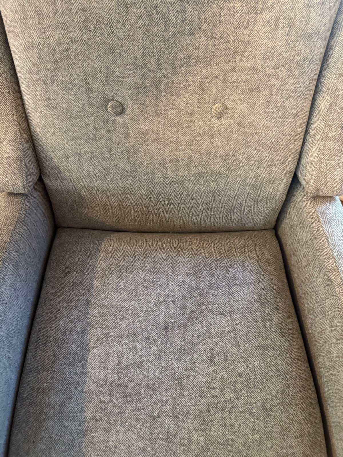 Close view of the tufted back and seat
