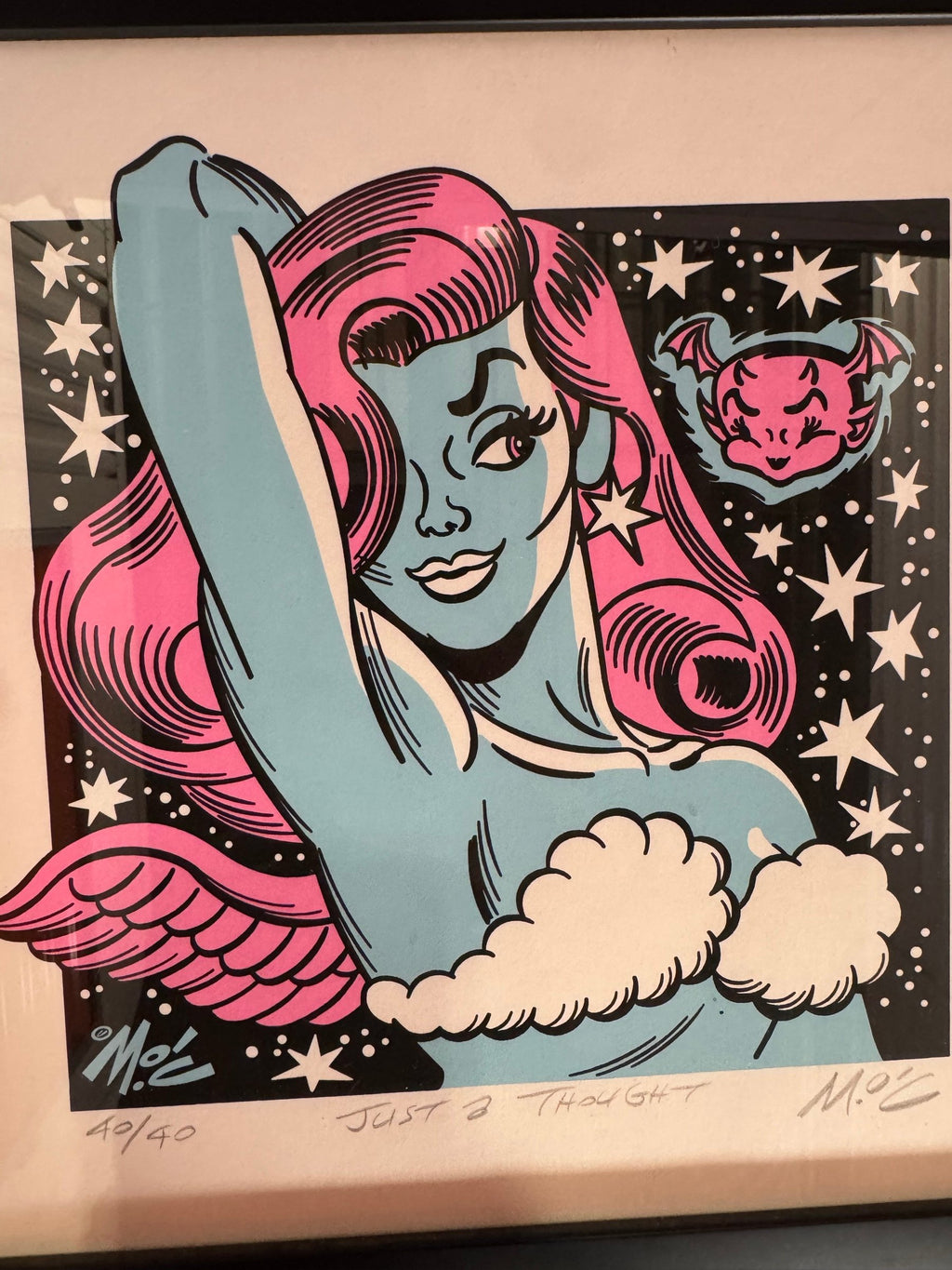 Close view of the pin-up with pink hair and wings