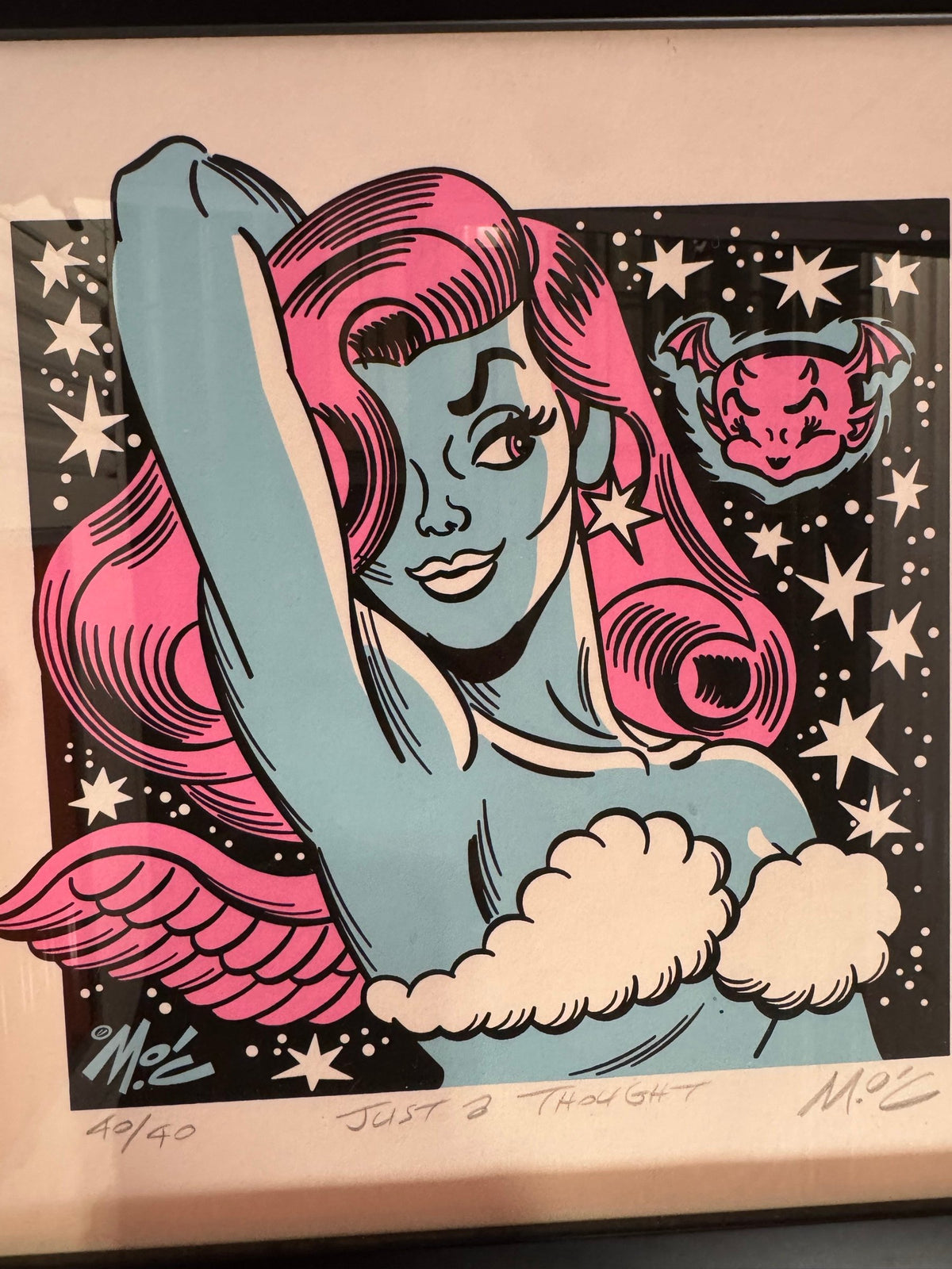 Close view of the pin-up with pink hair and wings