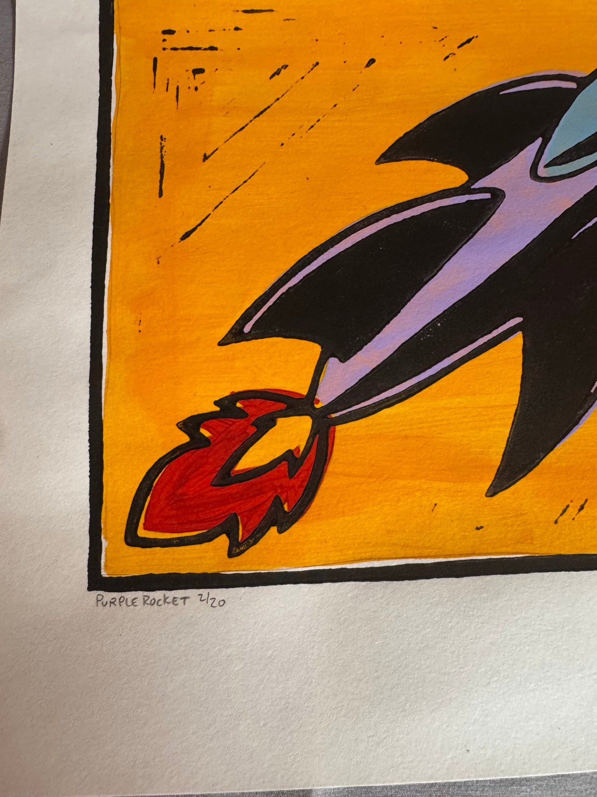 Pencil title and edition number 5/20 on the rocket linocut