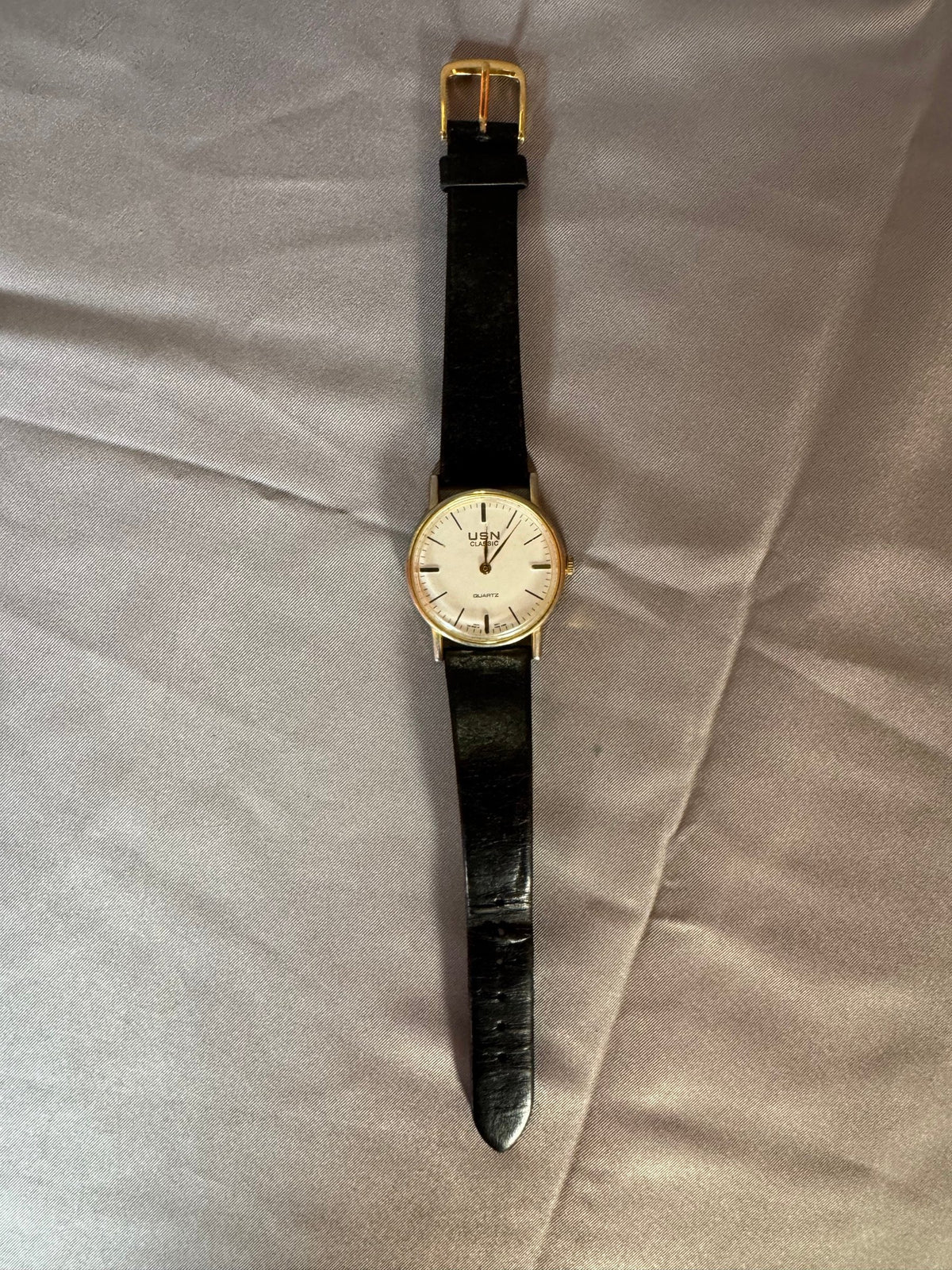 USN Classic gold-tone watch, face up
