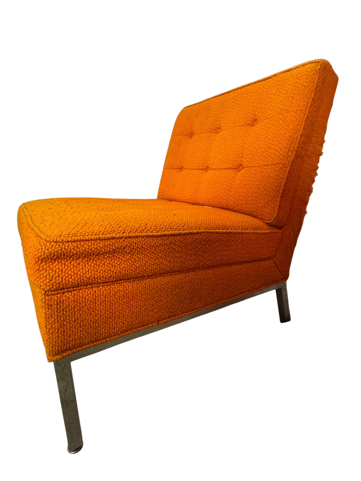 Orange slipper chair side view showing chrome leg