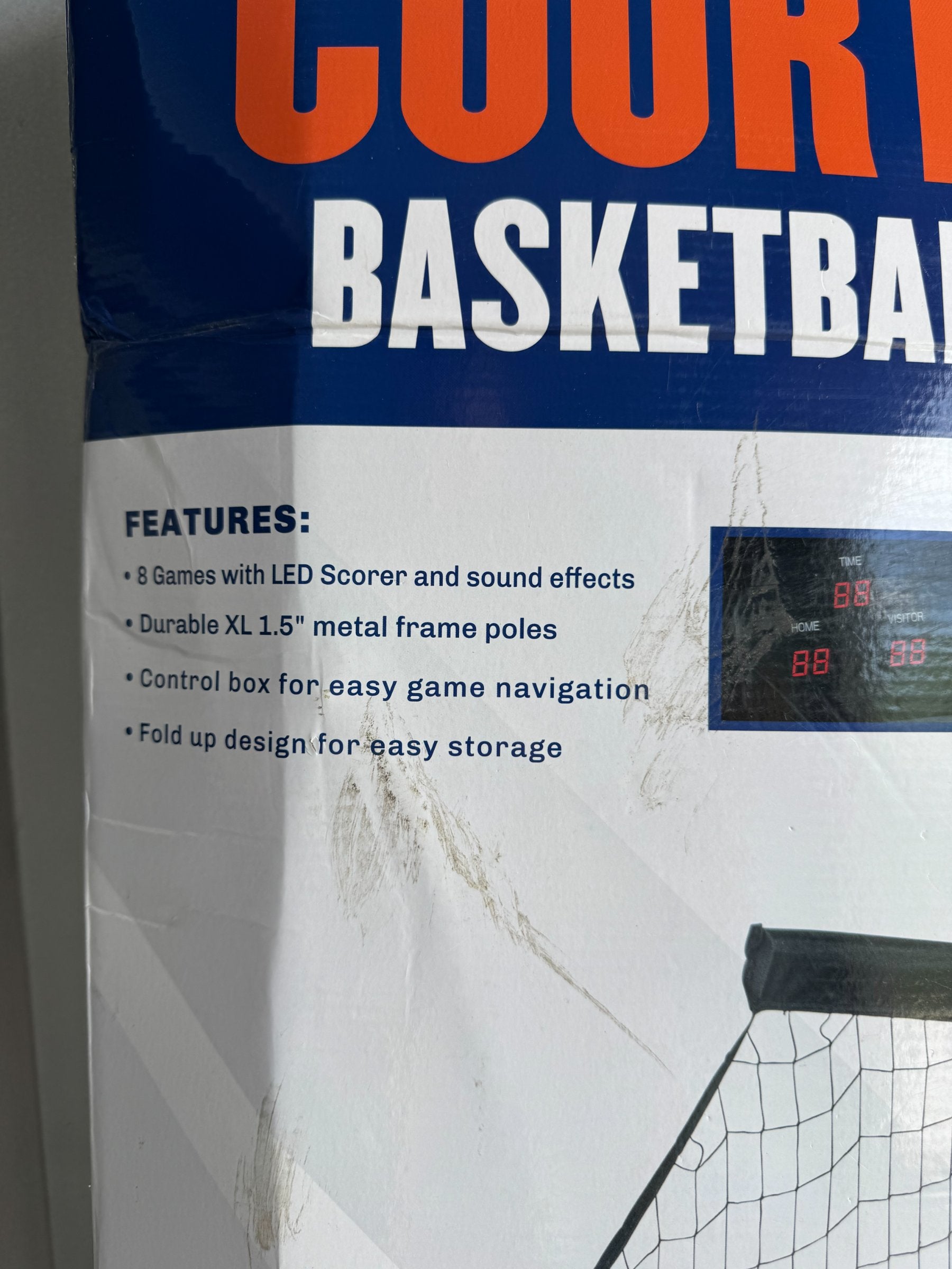 Product packaging back panel detailing features: LED scorer with sound effects, durable XL 1.5 inch metal frame poles, control box, fold-up design for storage