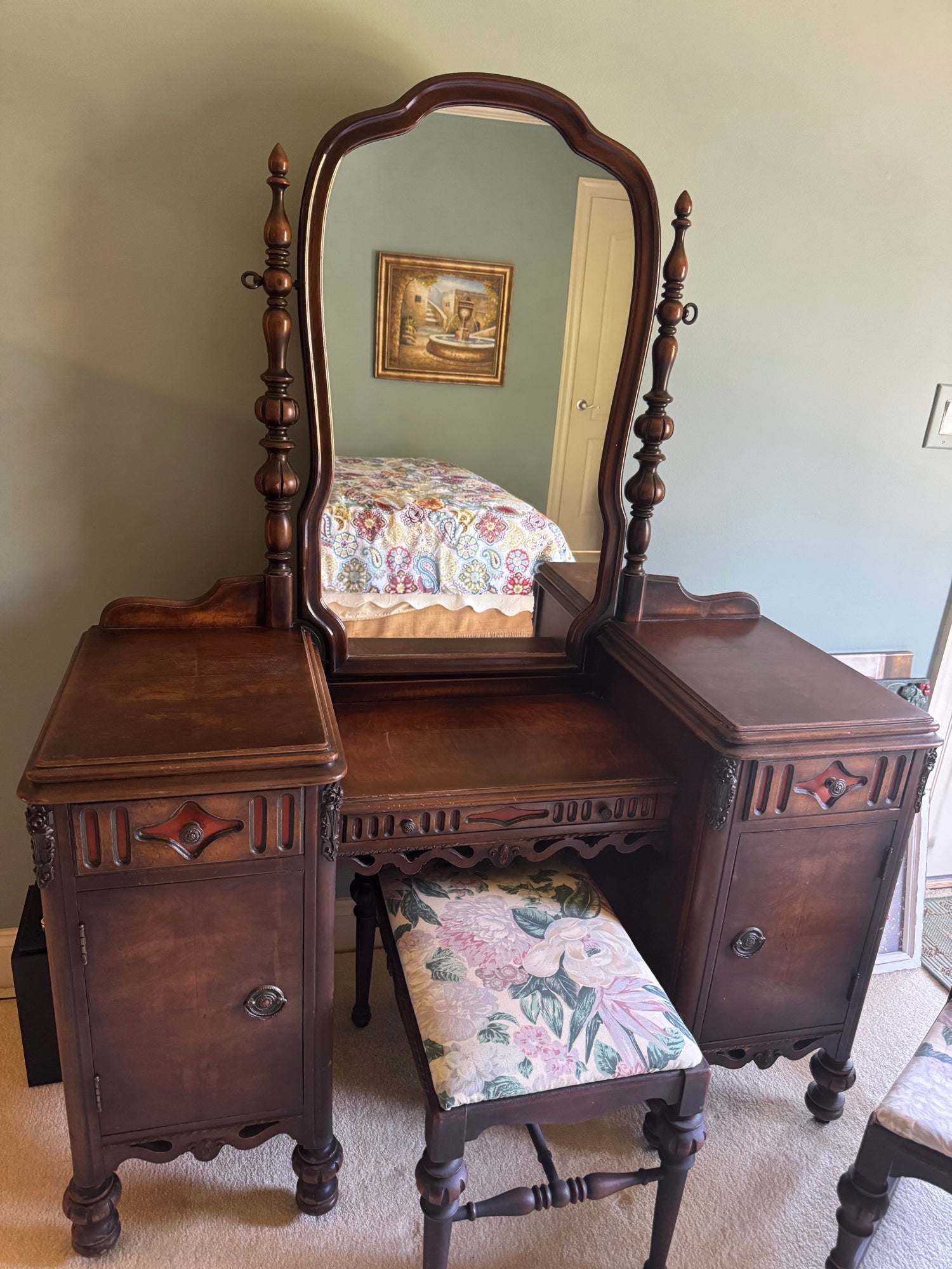 Antique walnut vanity with swing mirror, two pedestals with cabinet doors, and upholstered bench seat