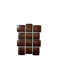 Copper-toned twelve-tile metal wall sculpture mounted on a beige wall near a thermostat.