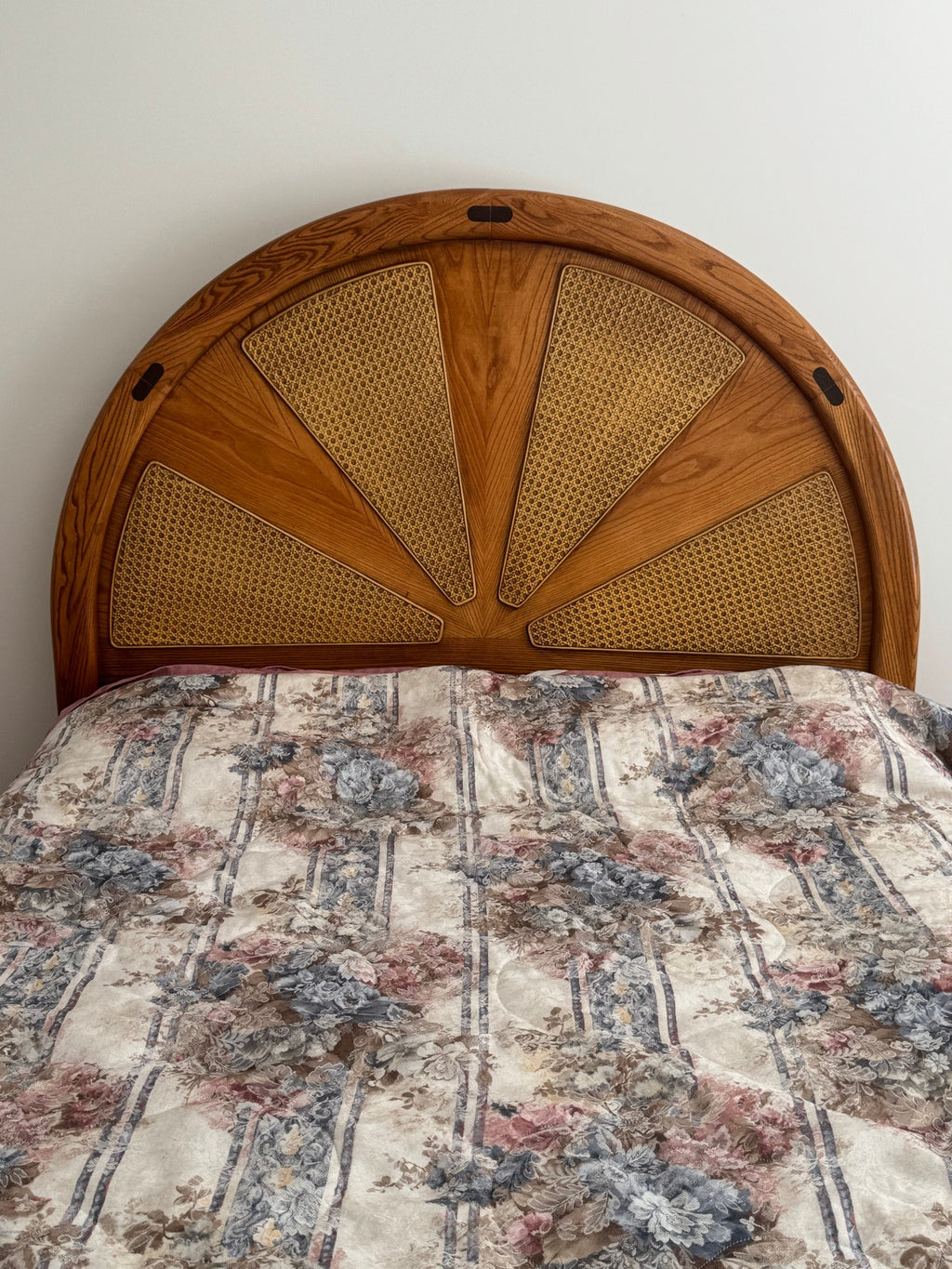 Close view of the sunburst cane headboard