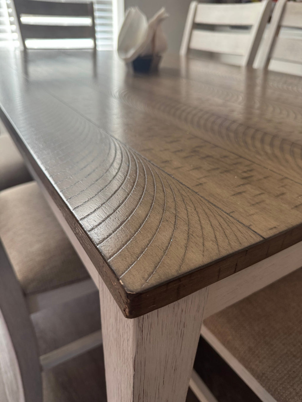 Corner of the Skempton tabletop showing the plank-look finish